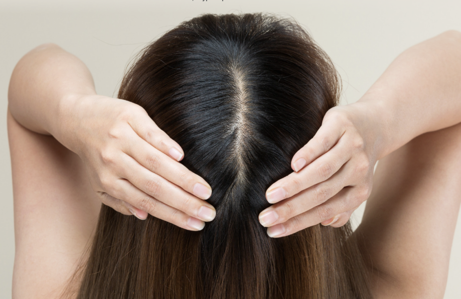 Woman pulling hair back